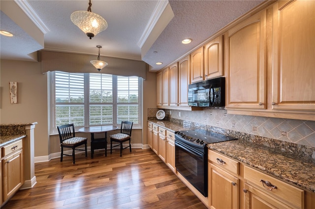 kitchen featuring black appliances, decorative backsplash, hanging light fixtures, and ornamental molding