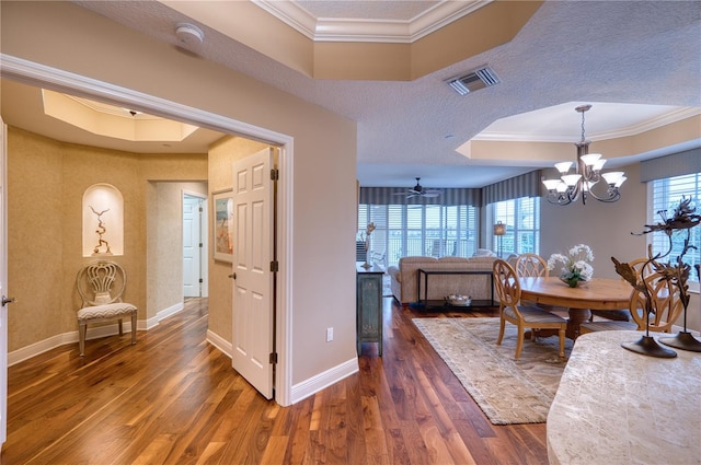 dining room featuring ornamental molding, dark hardwood / wood-style floors, and plenty of natural light