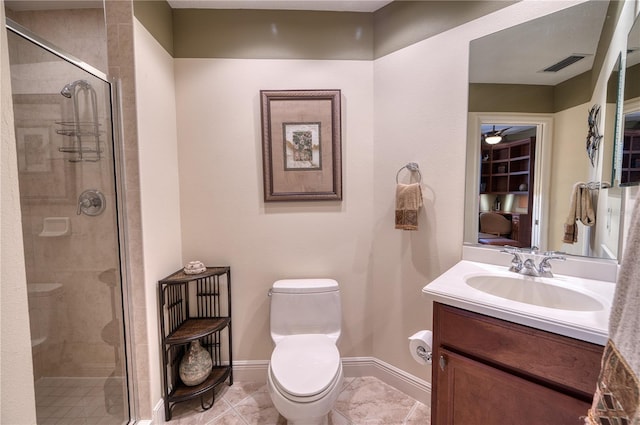 bathroom featuring tile patterned floors, toilet, walk in shower, and vanity