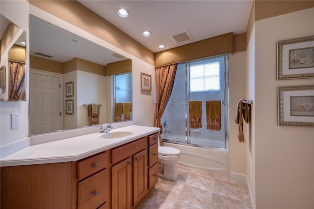 full bathroom with toilet, shower / bath combination with glass door, and vanity