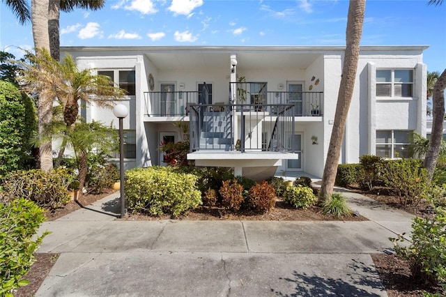 view of front of home featuring a balcony