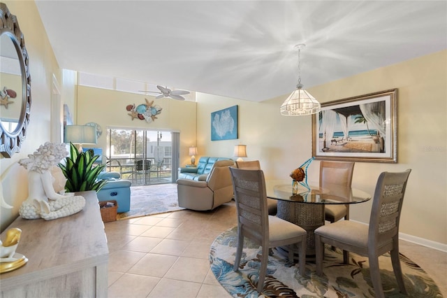 tiled dining space featuring ceiling fan