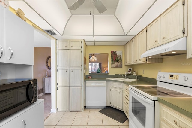 kitchen with sink, white appliances, ceiling fan, and light tile patterned flooring