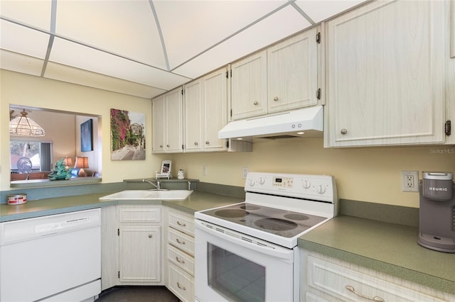 kitchen featuring white appliances and sink