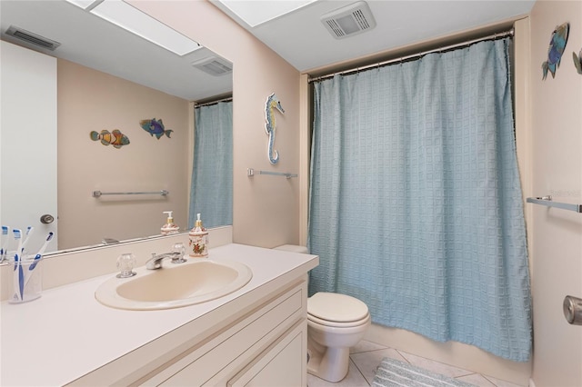 full bathroom featuring vanity, tile patterned floors, toilet, and shower / tub combo with curtain