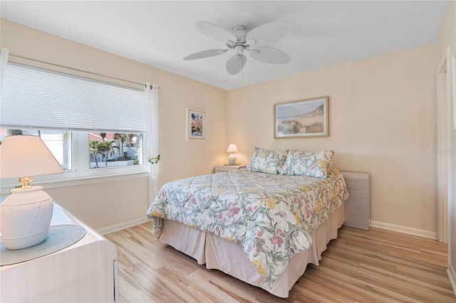 bedroom with light wood-type flooring and ceiling fan