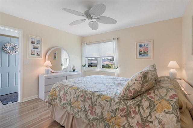 bedroom with ceiling fan and light wood-type flooring