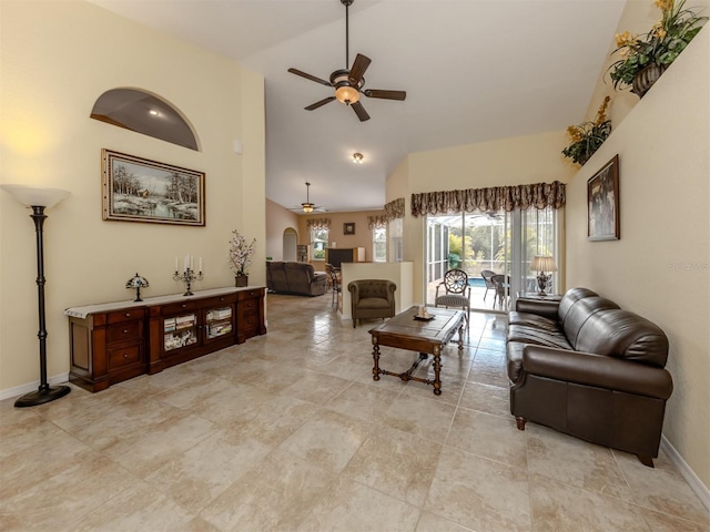 living room with ceiling fan and lofted ceiling