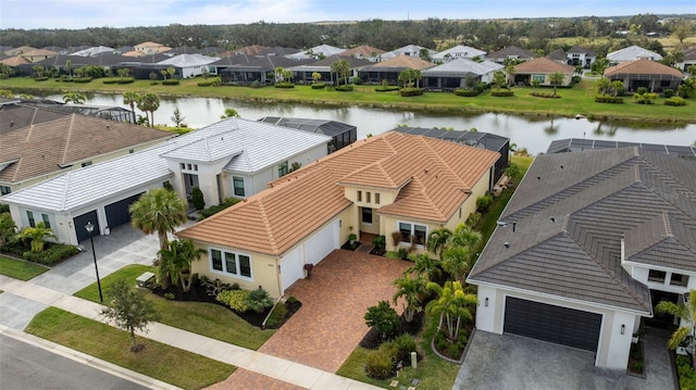 birds eye view of property featuring a water view