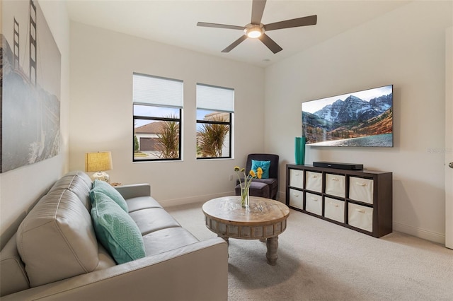 living room with light carpet and ceiling fan