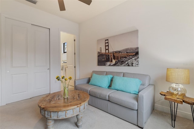 living room with light colored carpet and ceiling fan