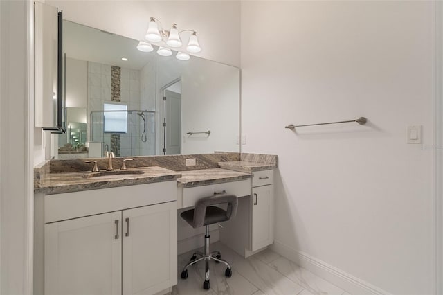 bathroom featuring vanity and a shower with shower door