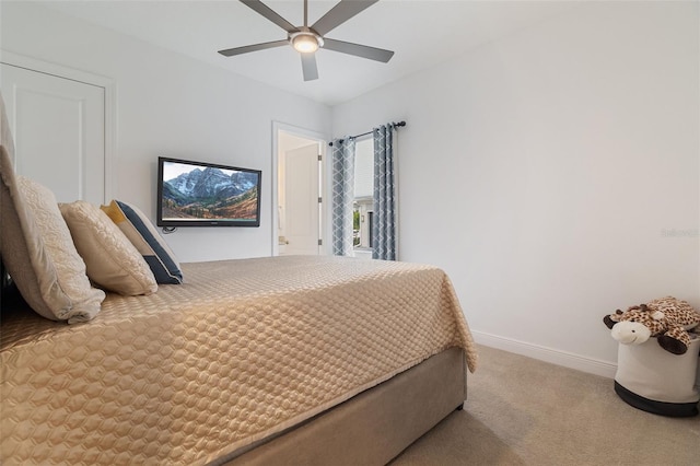 carpeted bedroom with ceiling fan