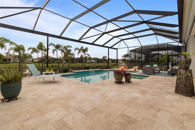 view of pool featuring a patio area, outdoor lounge area, a hot tub, and glass enclosure