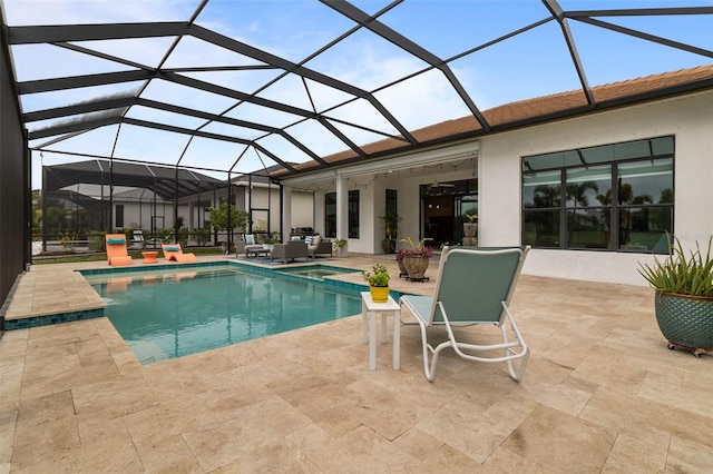 view of pool featuring a patio and a lanai