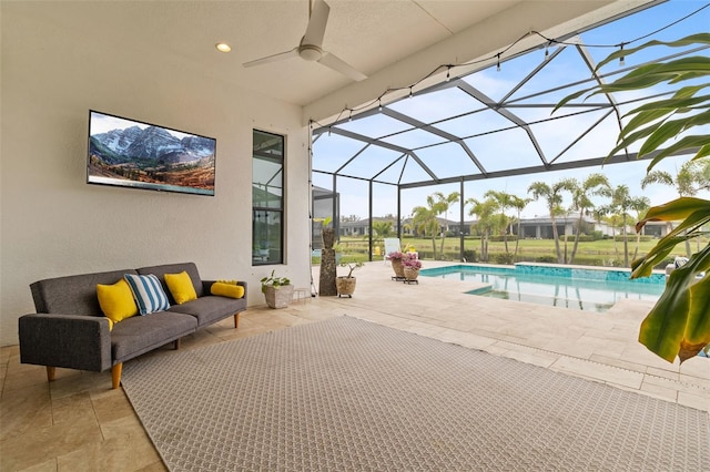 view of patio / terrace featuring outdoor lounge area, ceiling fan, and a lanai