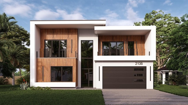 modern home featuring a garage and a front yard