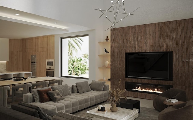 living room with wooden walls, tile patterned floors, a fireplace, a chandelier, and built in shelves