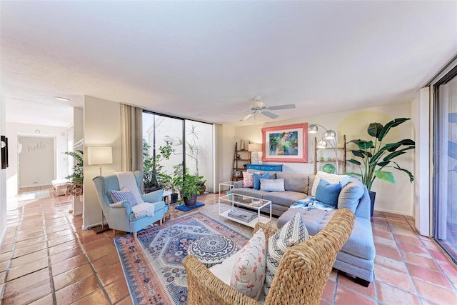 living room with tile patterned floors and ceiling fan