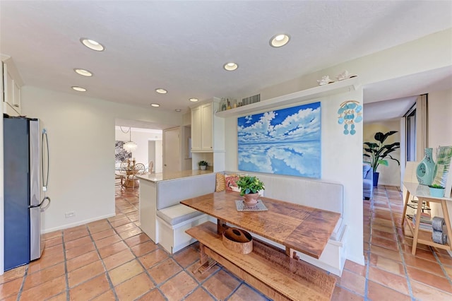 dining area featuring breakfast area, recessed lighting, and baseboards