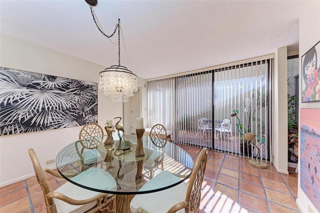 dining space with a notable chandelier and light tile patterned flooring