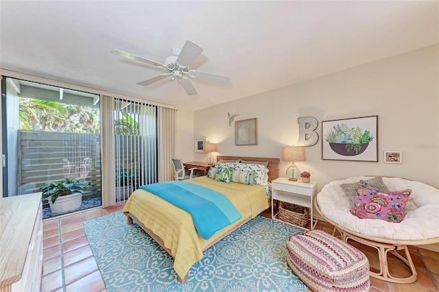 bedroom with access to exterior, ceiling fan, expansive windows, and tile patterned flooring