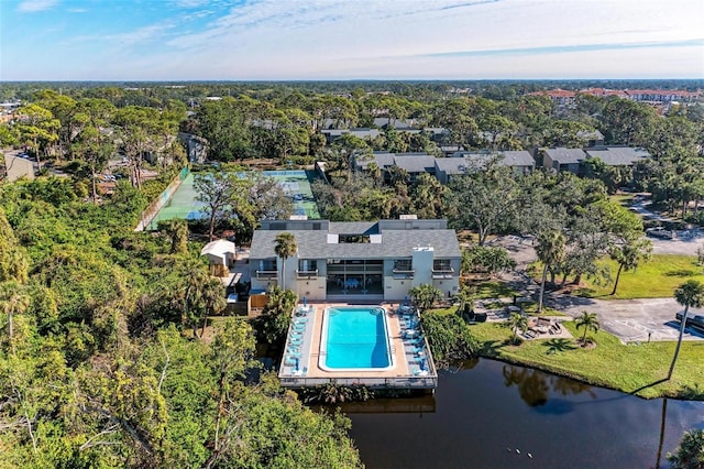 birds eye view of property with a water view