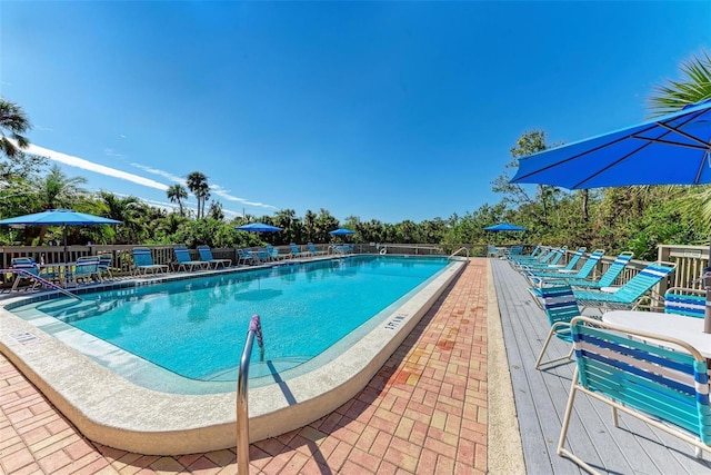 community pool featuring fence