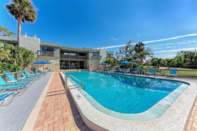 view of swimming pool with a patio