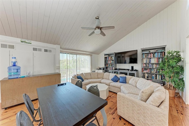 living area featuring light wood-type flooring, visible vents, and ceiling fan