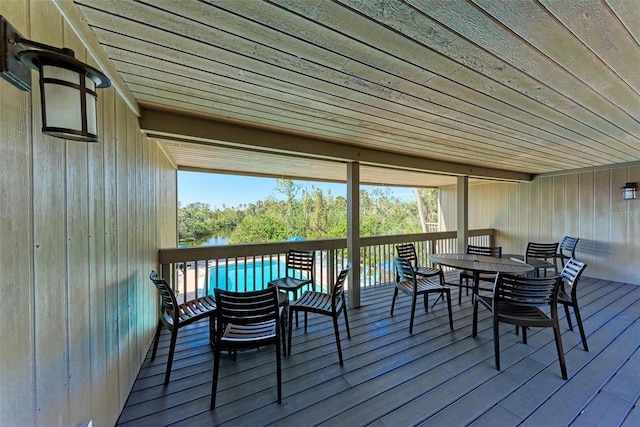 wooden terrace featuring outdoor dining area