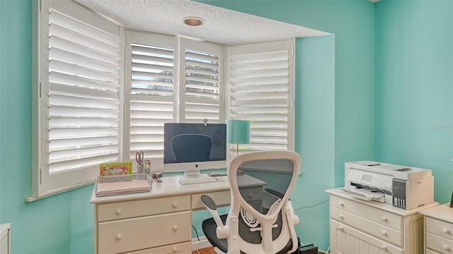 office space featuring a textured ceiling