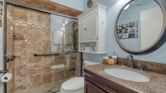 bathroom featuring walk in shower, vanity, and toilet