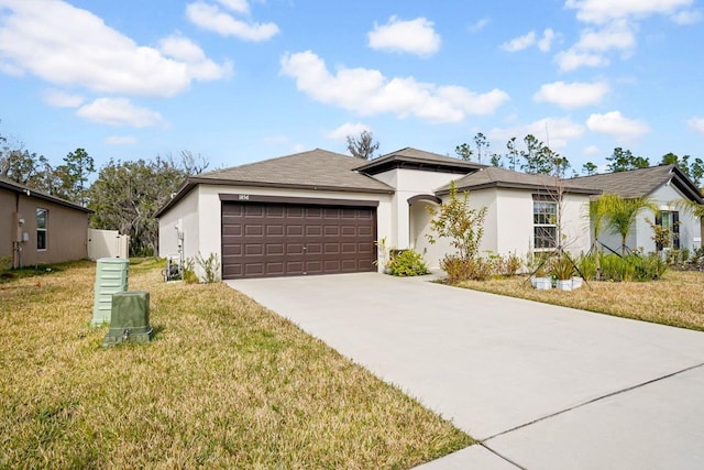 view of front facade with a garage and a front lawn