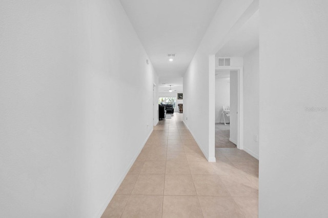 corridor featuring light tile patterned flooring