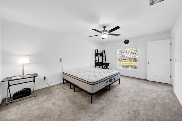 bedroom featuring light carpet and ceiling fan