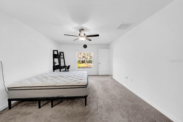 bedroom with ceiling fan and carpet floors