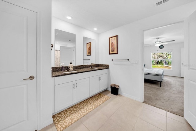 bathroom with tile patterned floors, ceiling fan, and vanity