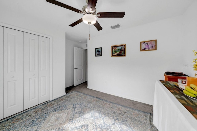 bedroom with carpet floors, a closet, and ceiling fan