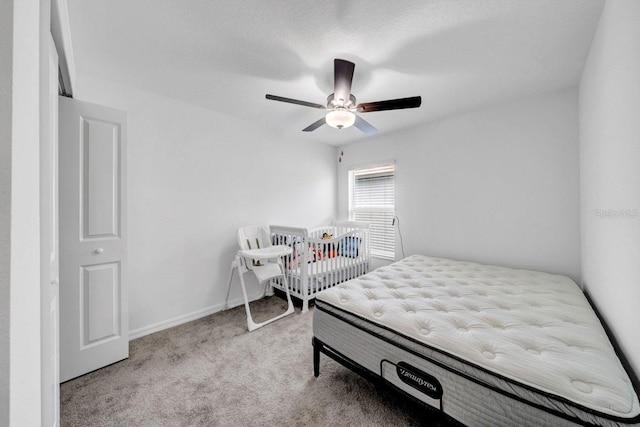 bedroom with light colored carpet and ceiling fan