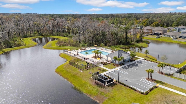 birds eye view of property with a water view