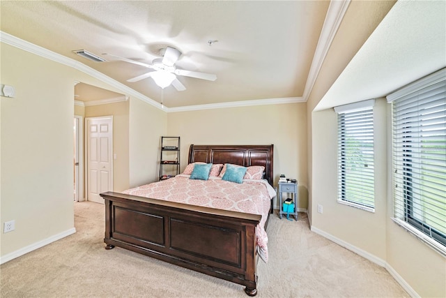 carpeted bedroom with crown molding and ceiling fan