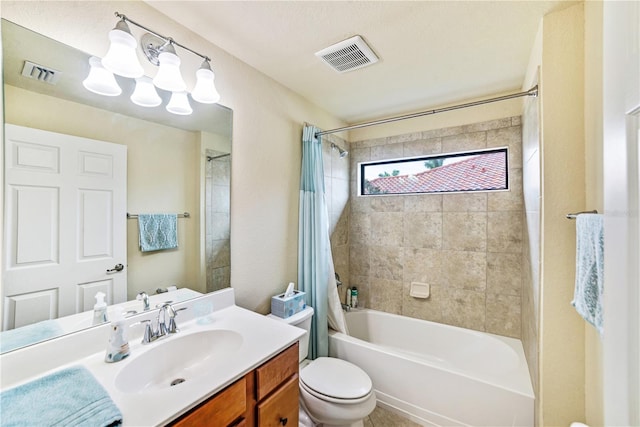 full bathroom with shower / tub combo with curtain, vanity, and toilet