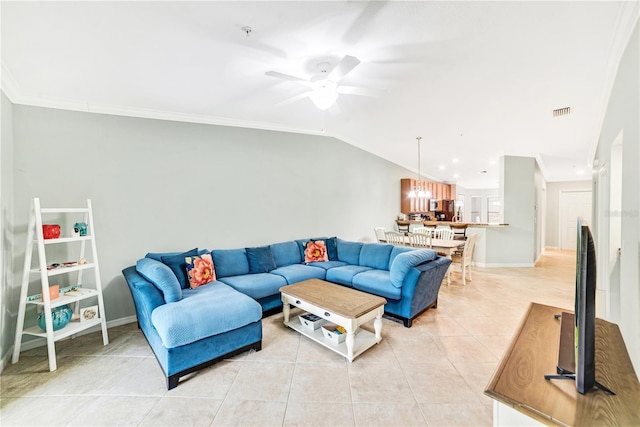 living room with light tile patterned floors, ceiling fan, visible vents, vaulted ceiling, and crown molding