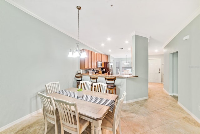 dining space with a notable chandelier, crown molding, lofted ceiling, light tile patterned flooring, and baseboards