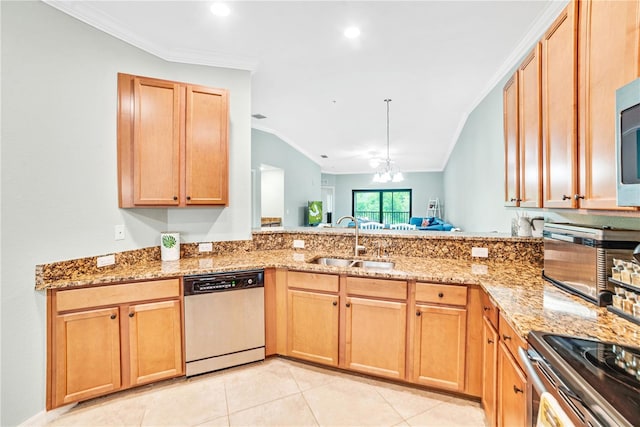 kitchen featuring appliances with stainless steel finishes, light stone counters, a sink, and ornamental molding