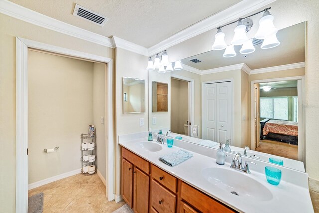 ensuite bathroom featuring double vanity, a closet, visible vents, connected bathroom, and a sink