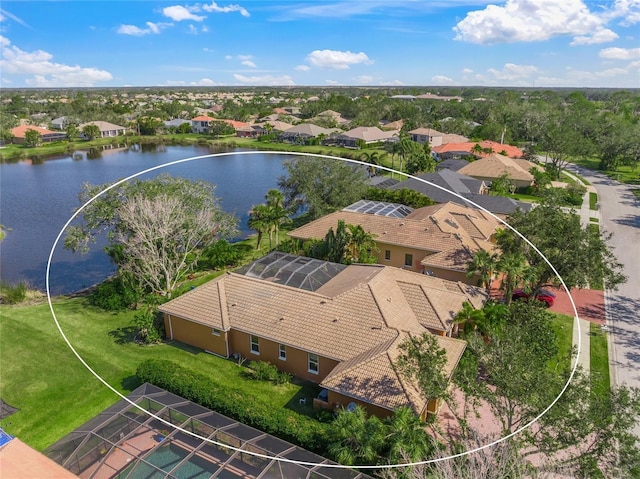 birds eye view of property with a water view