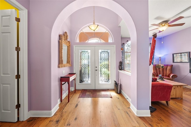 entrance foyer featuring hardwood / wood-style flooring and french doors