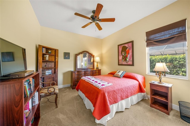 bedroom featuring ceiling fan and light colored carpet